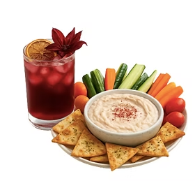 Catering spread with a drink, hummus, vegetables, and crackers.